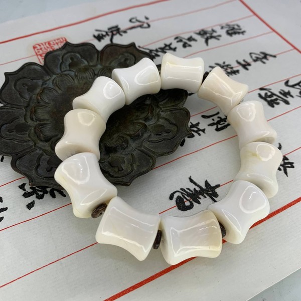 Чётки кеджу раковина моллюска 11 бусин 18х16 мм
			