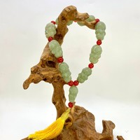 Четки нефрит архаты 9 бусин 15х10 мм 