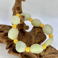 Четки нефрит орнамент 8 бусин 25х10 мм 